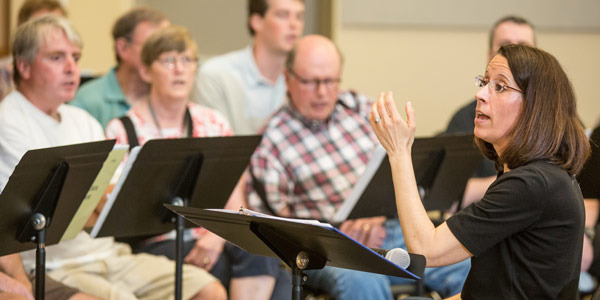 Image: Director Karen McFeeters Leary leading the Aphasia Choir members in rehearsal.