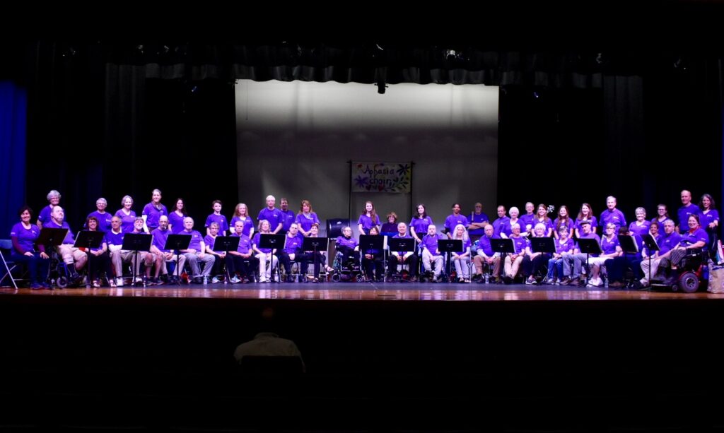 Image: The Aphasia Choir on stage at one of their concerts